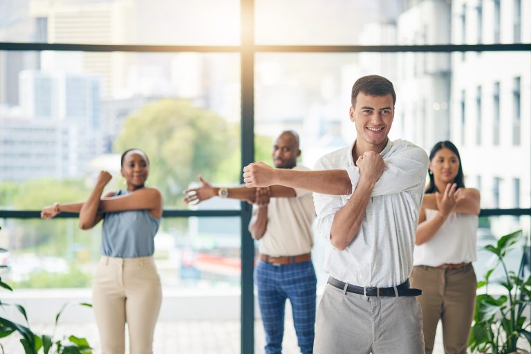 Employees doing a wellness class