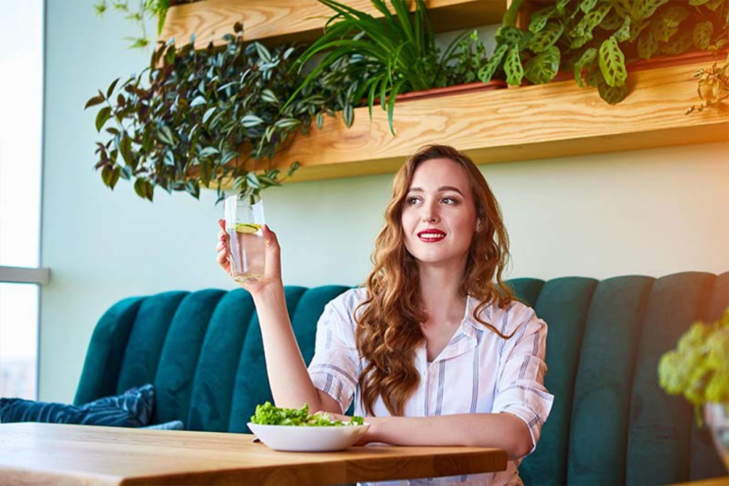 woman enjoying a drink in a cafe