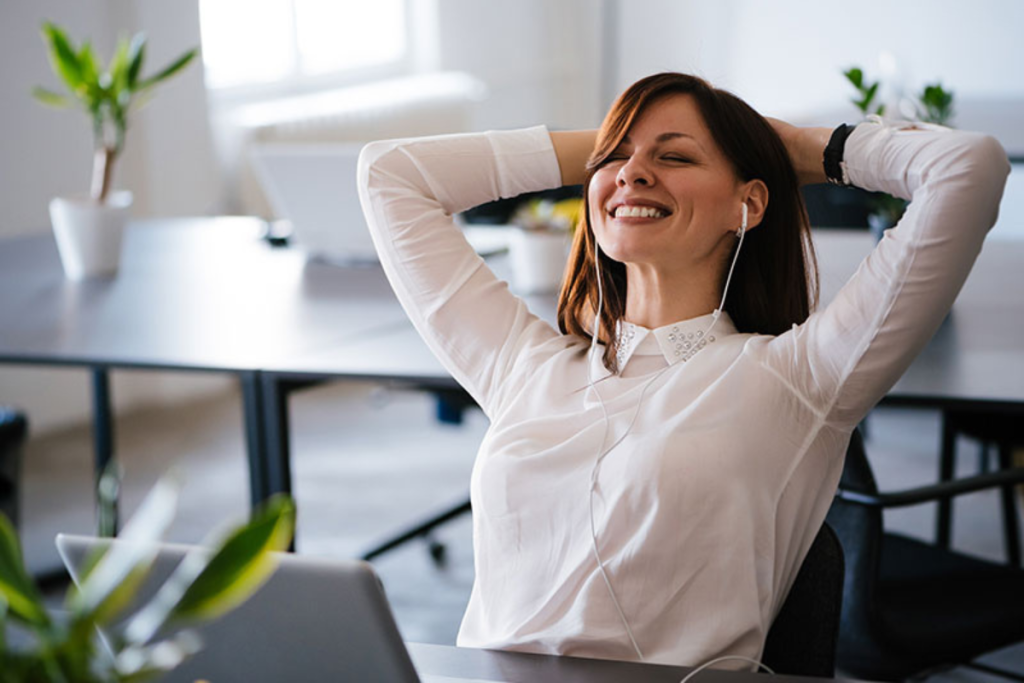 employee listening to music at desk
